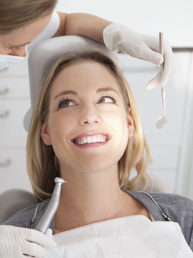 germany-young-woman-getting-her-teeth-examined-by-royalty-free-image-1572251324